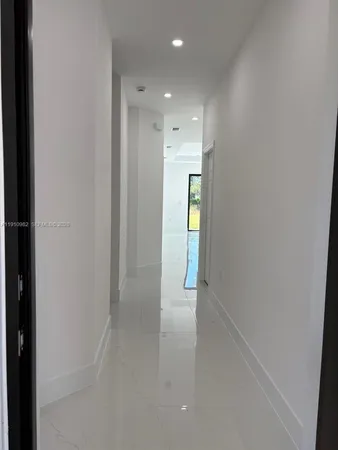 a view of an empty room and a windows