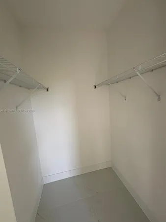 a view of an empty walk in closet