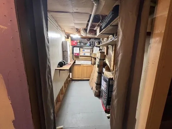 a view of a hallway with stairs