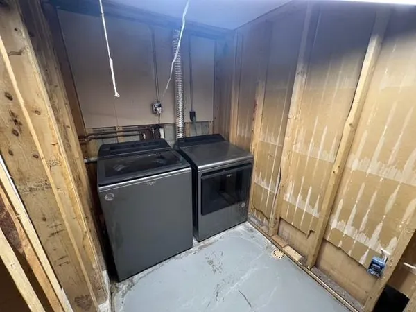 a utility room with dryer and washer