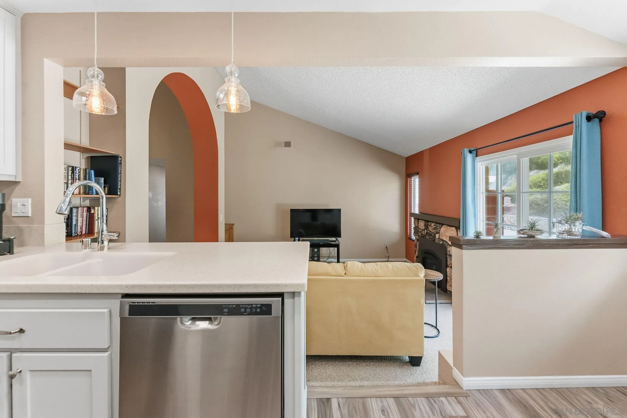 10565 Strathmore Drive Santee, CA 92071 - Photo 21 of 59 a room with a table chairs and a refrigerator