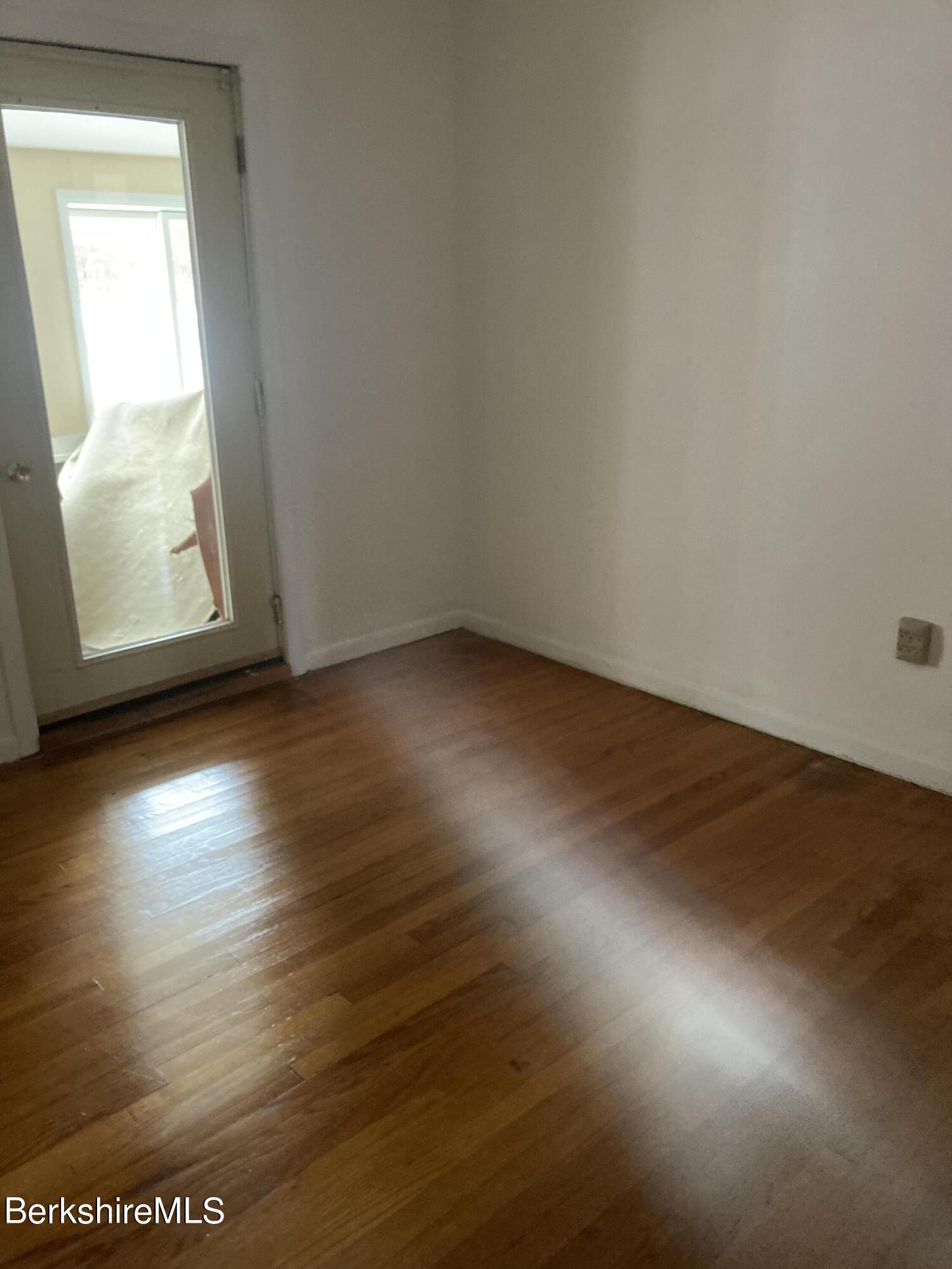 34 West Center Road West Stockbridge, MA 01266 - Photo 12 of 30 an empty room with wooden floor and windows