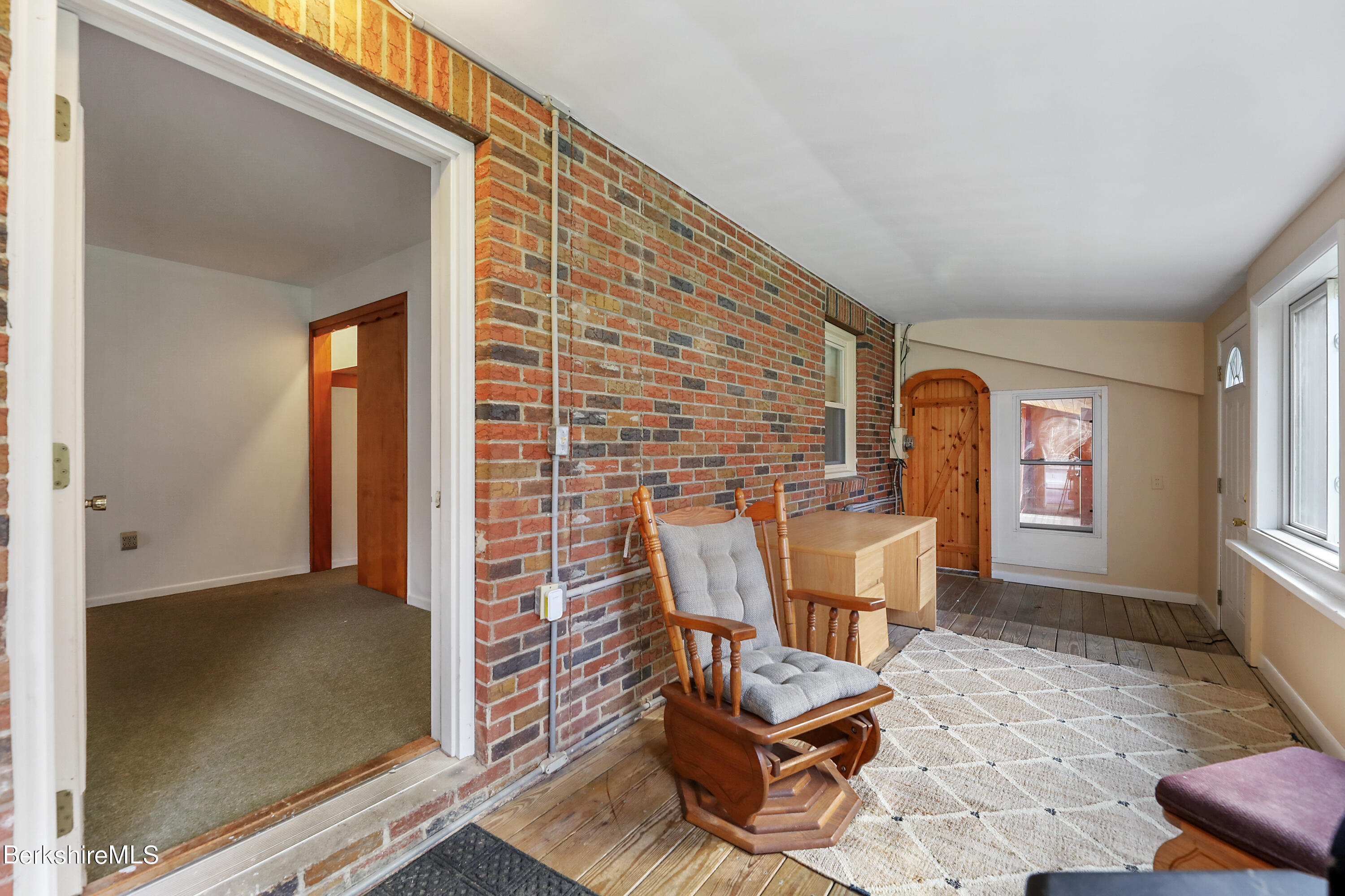 34 West Center Road West Stockbridge, MA 01266 - Photo 18 of 30 a brick building with a bench and a window
