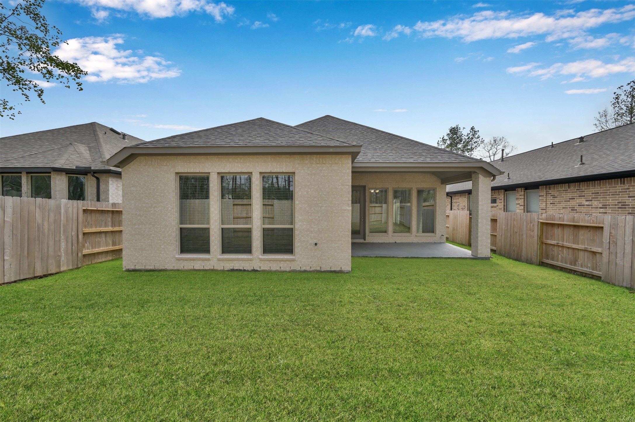 15715 Autumn Sun Conroe, TX 77302 - Photo 22 of 23 a view of a house with a garden