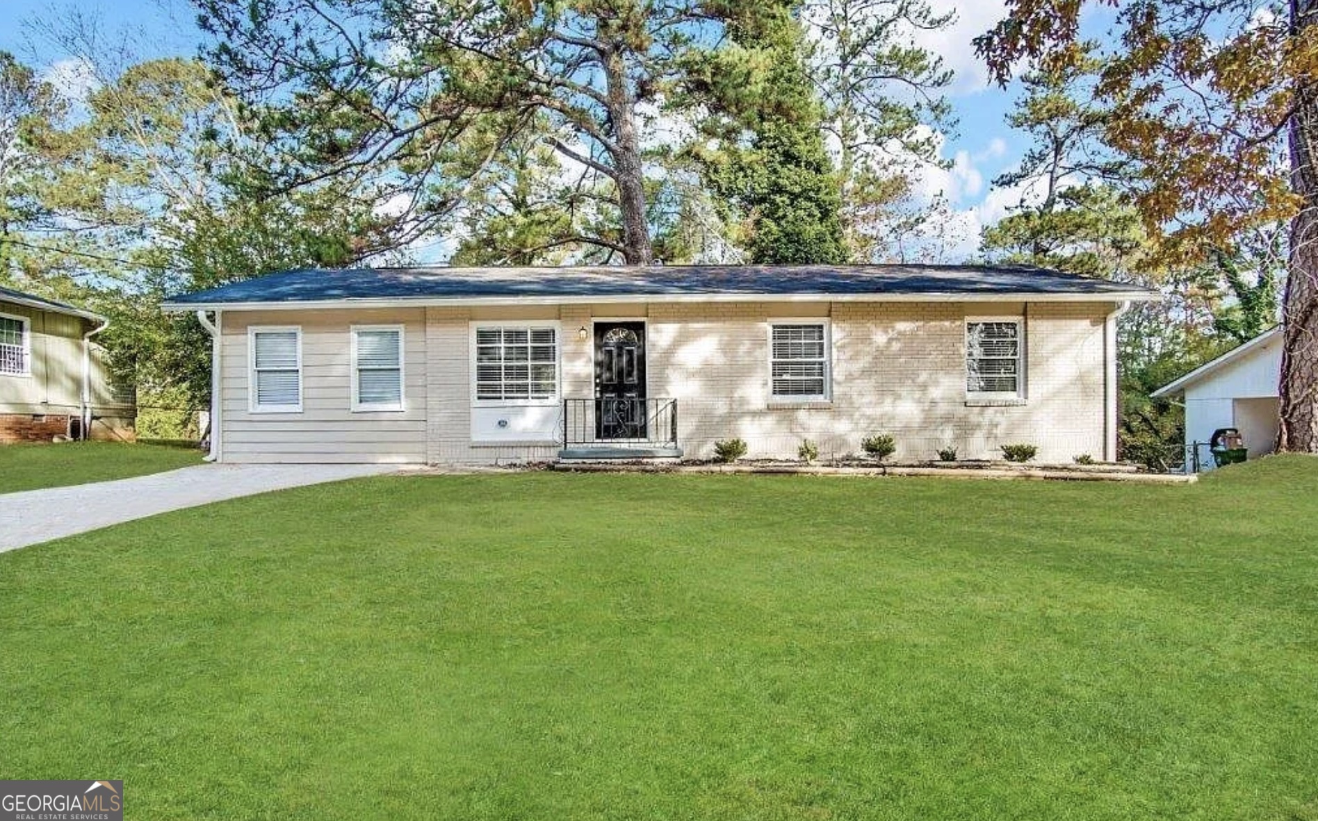 front view of a house with a yard
