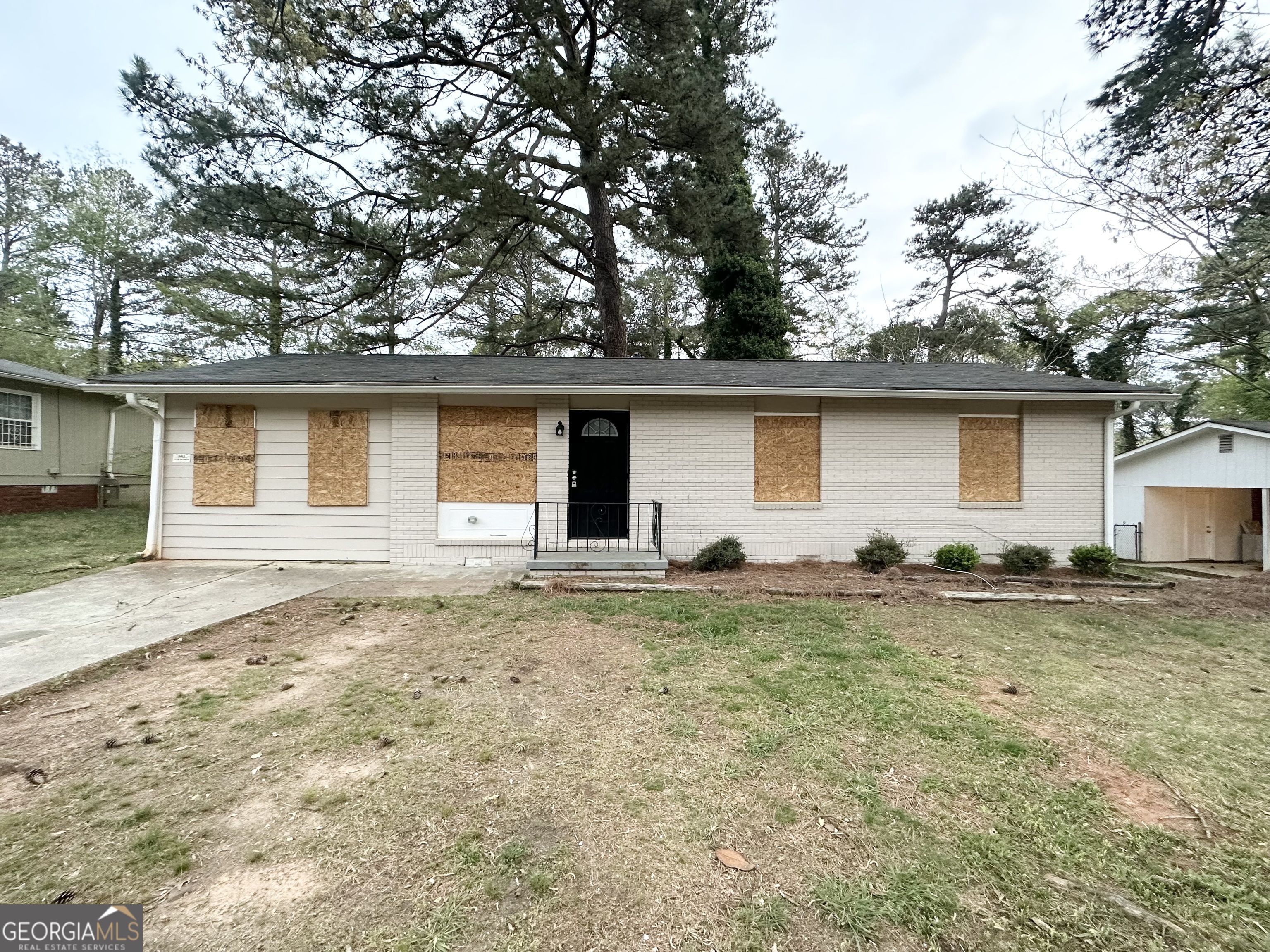 4390 Mercer Road Decatur, GA 30035 - Photo 2 of 11 a house with trees in the background