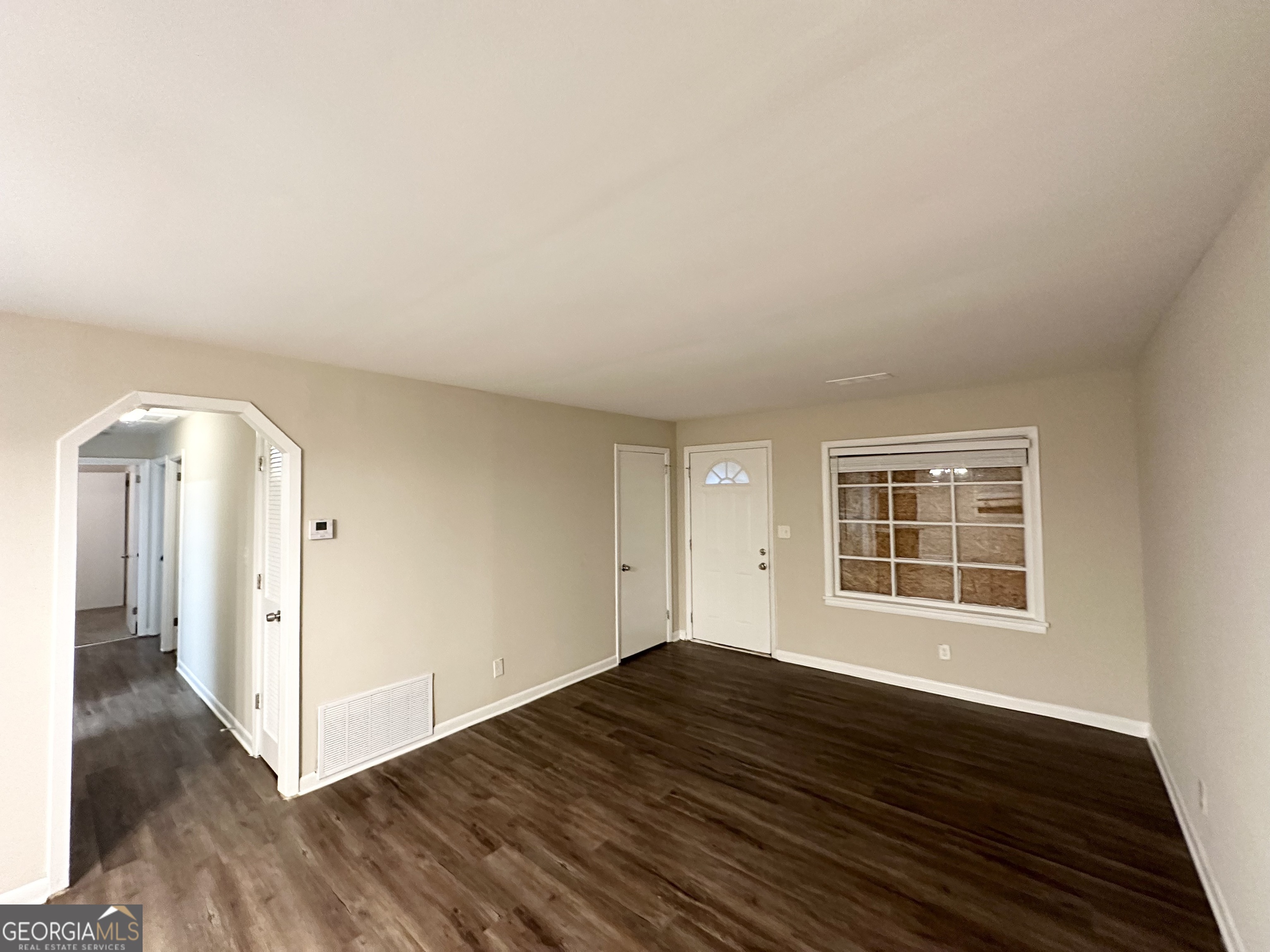 4390 Mercer Road Decatur, GA 30035 - Photo 5 of 11 a view of empty room with wooden floor and fan