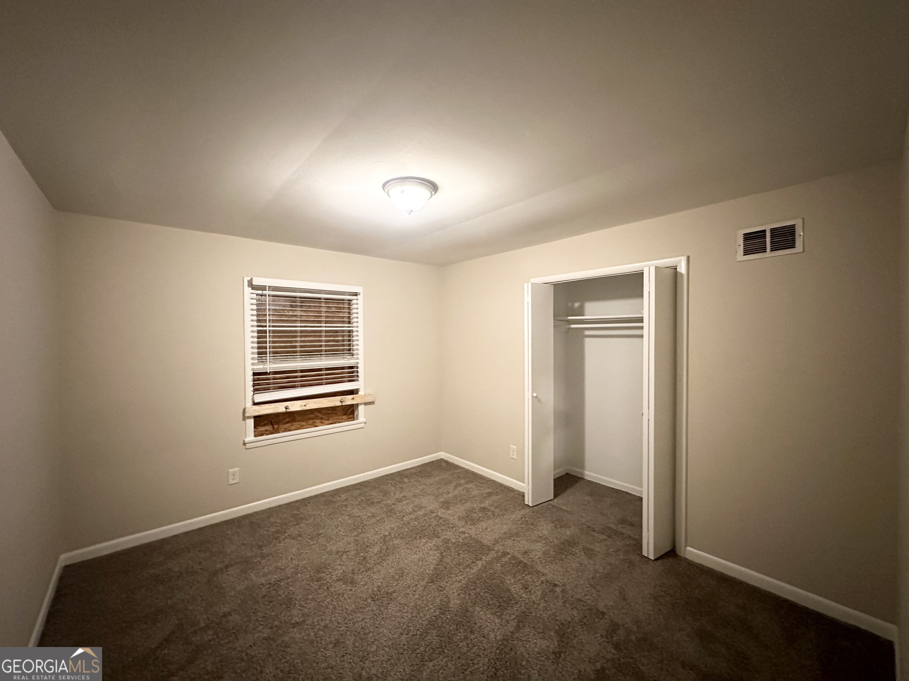 4390 Mercer Road Decatur, GA 30035 - Photo 7 of 11 a view of an empty room with a window