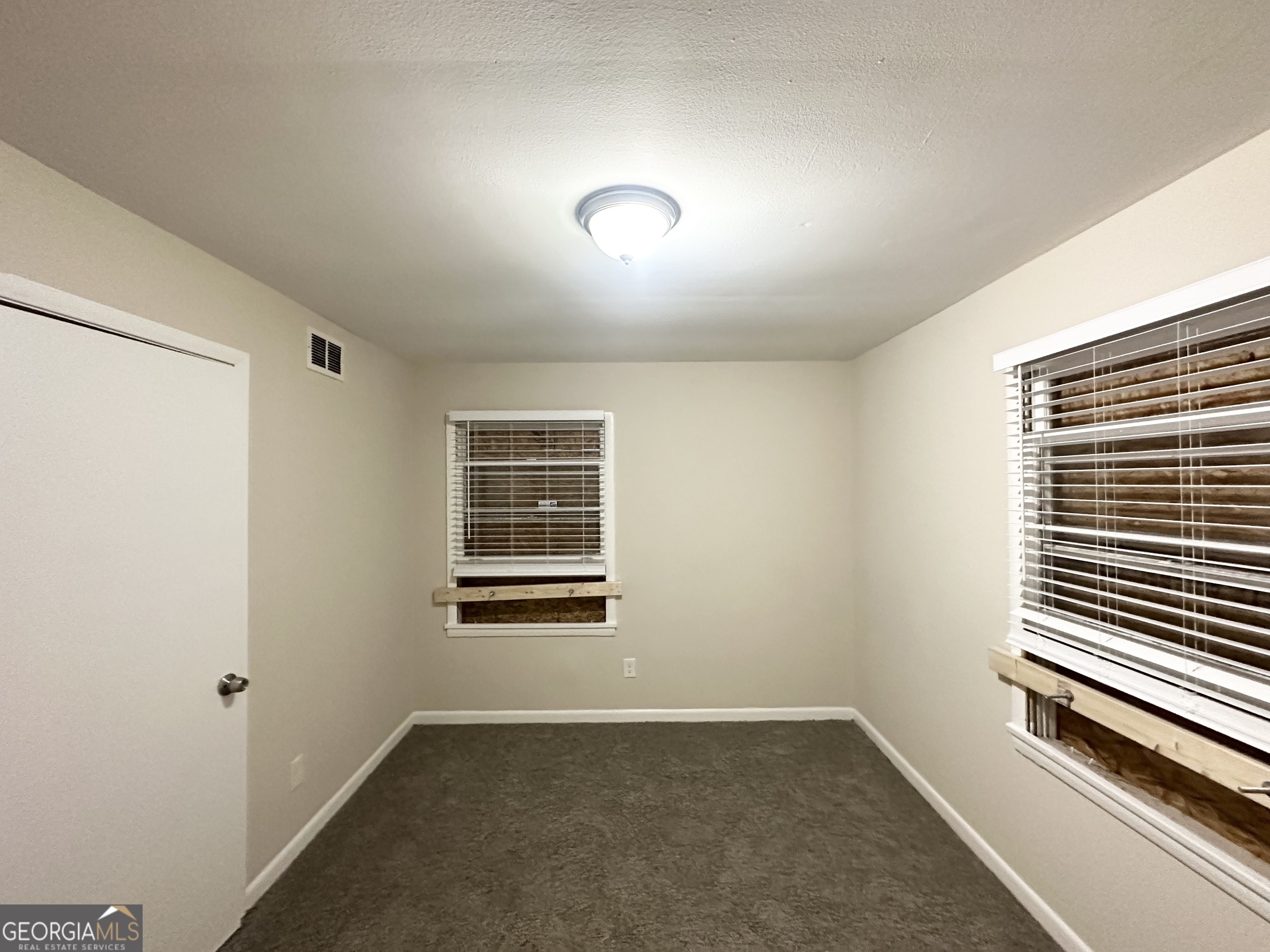 4390 Mercer Road Decatur, GA 30035 - Photo 8 of 11 an empty room with a window