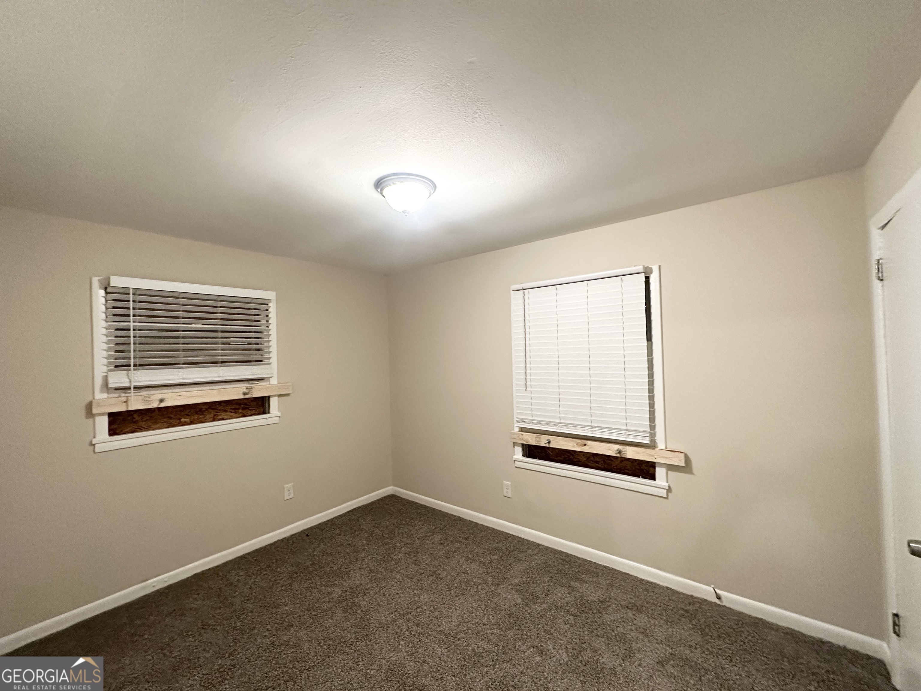 4390 Mercer Road Decatur, GA 30035 - Photo 9 of 11 an empty room with windows