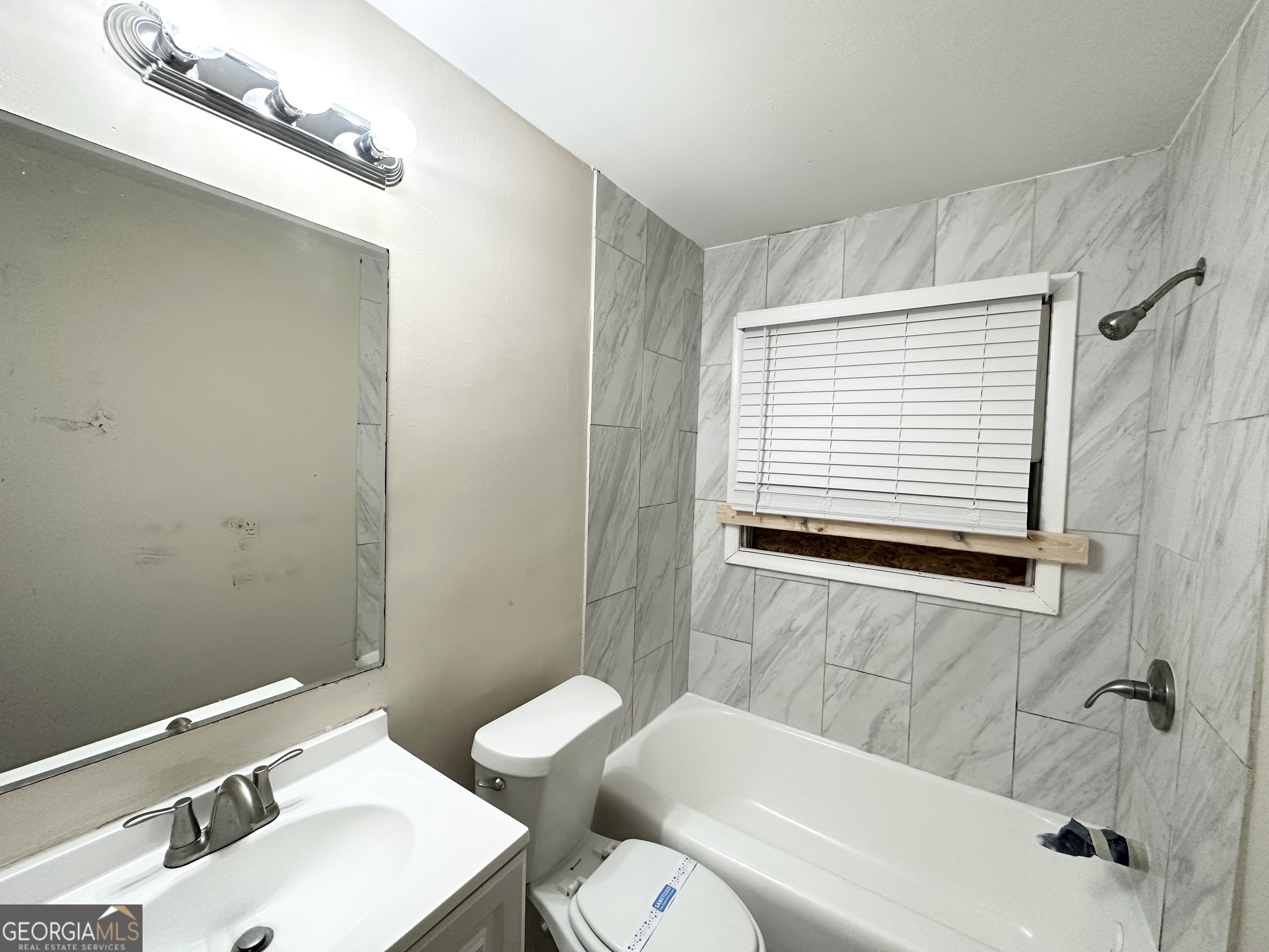 4390 Mercer Road Decatur, GA 30035 - Photo 10 of 11 a bathroom with a sink and a mirror