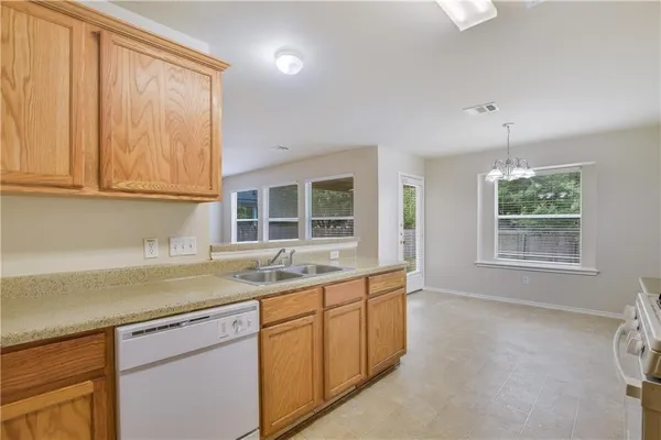 a kitchen with a sink and cabinets