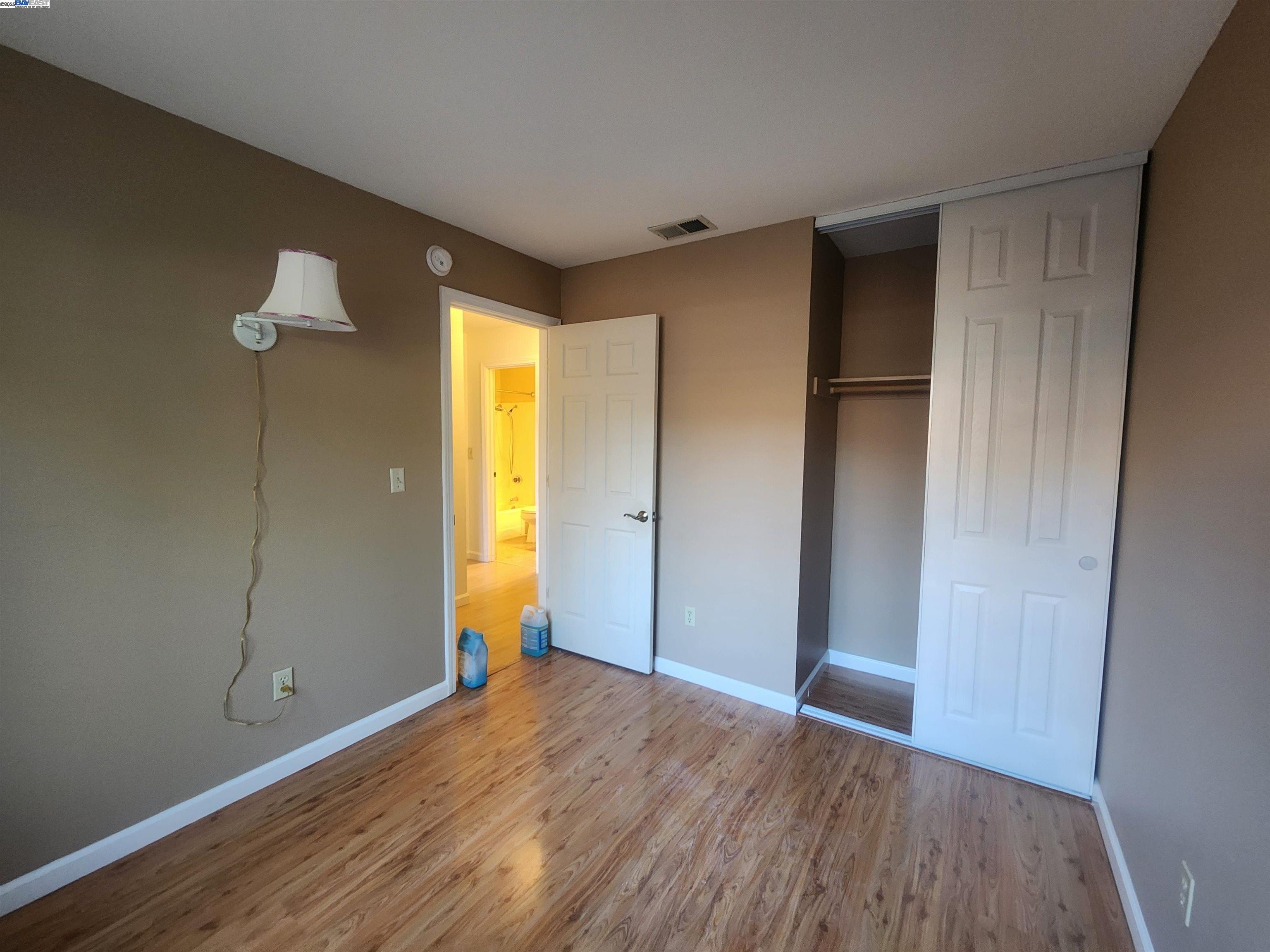 1733 Carnation Circle Livermore, CA 94551 - Photo 14 of 27 a view of empty room with wooden floor