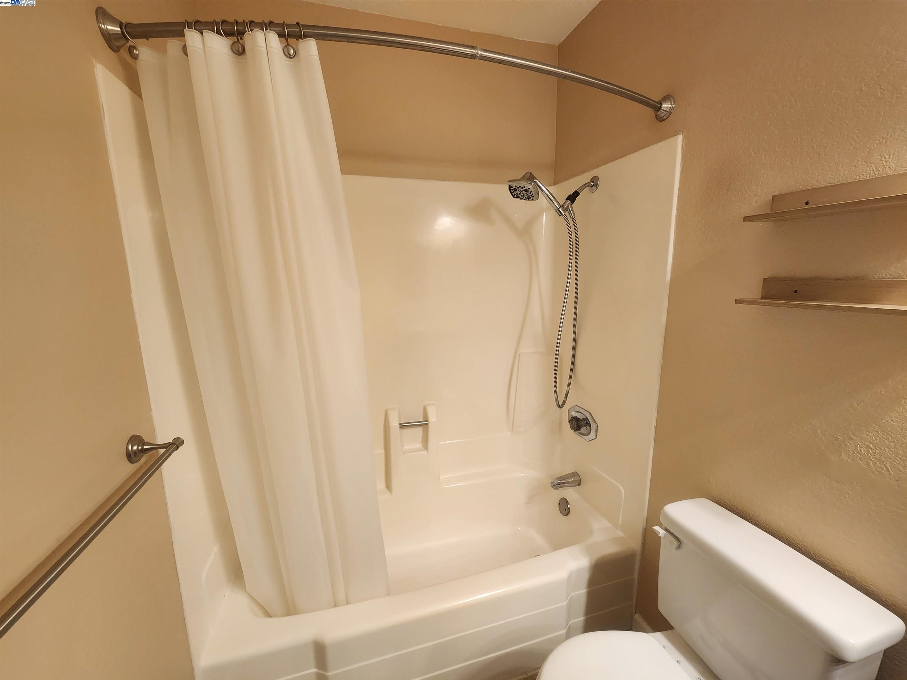 1733 Carnation Circle Livermore, CA 94551 - Photo 16 of 27 a bathroom with a shower and a toilet