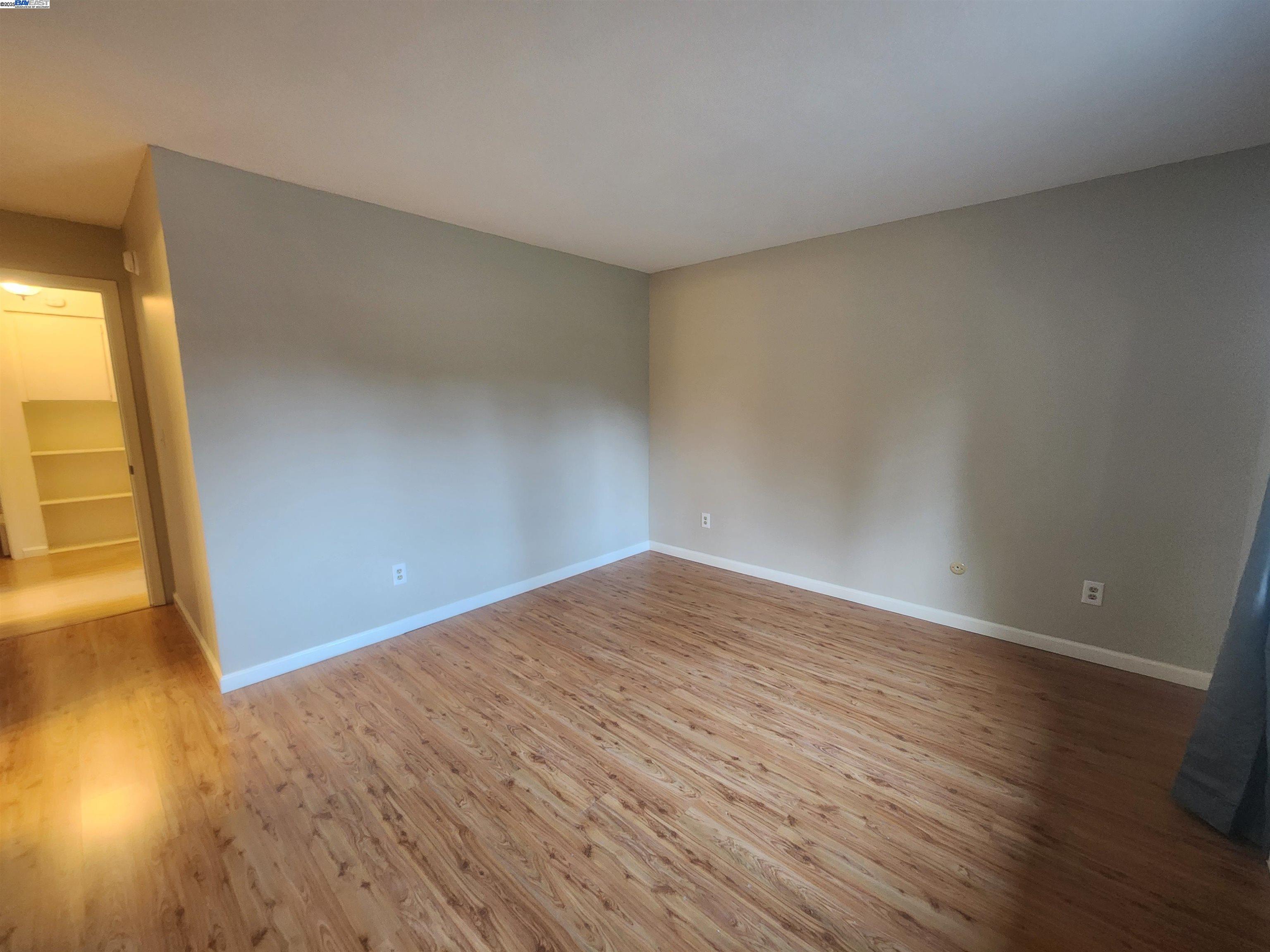 1733 Carnation Circle Livermore, CA 94551 - Photo 20 of 27 a view of empty room with wooden floor and fan