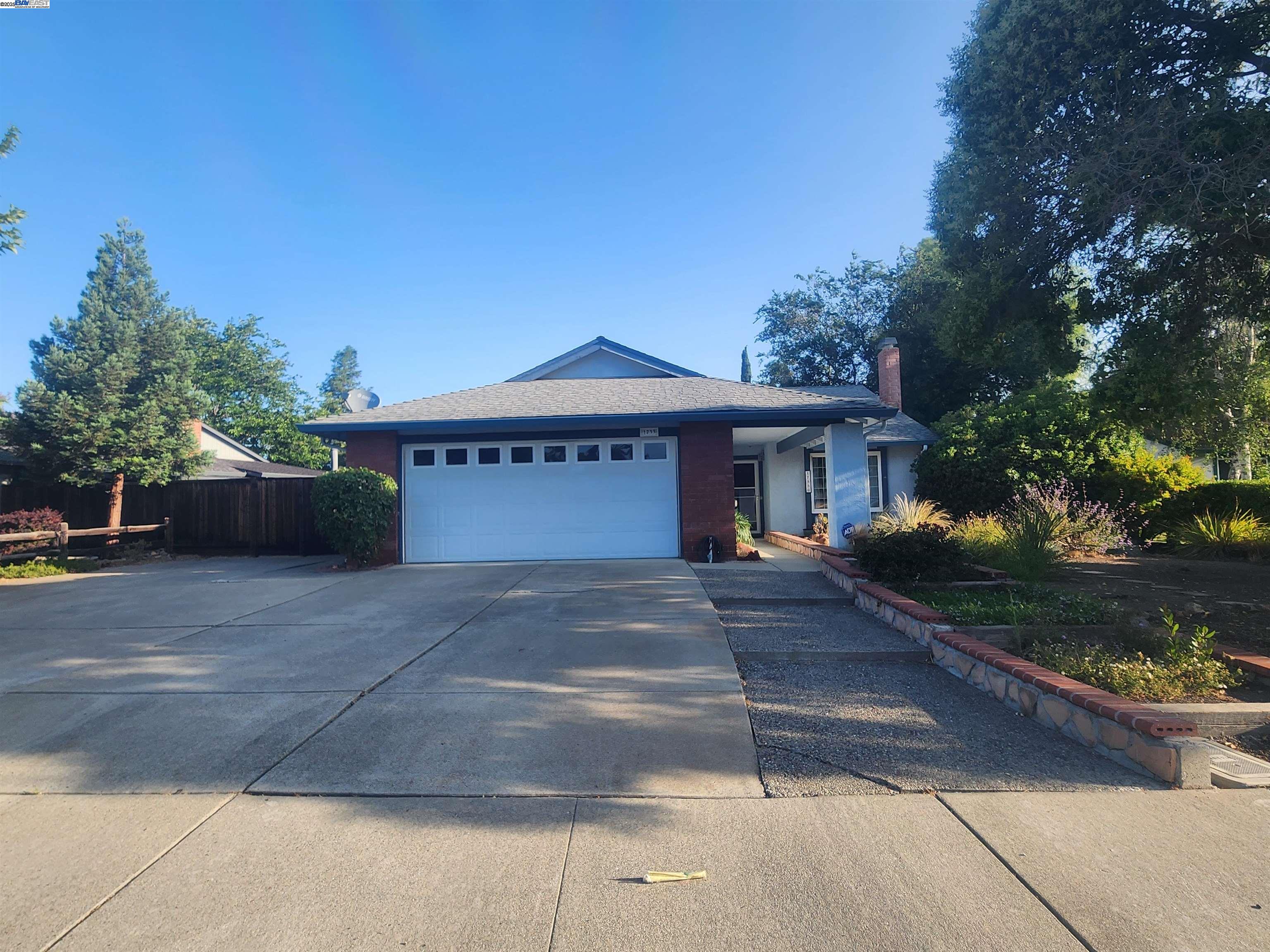 1733 Carnation Circle Livermore, CA 94551 - Photo 2 of 27 a front view of a house with a yard