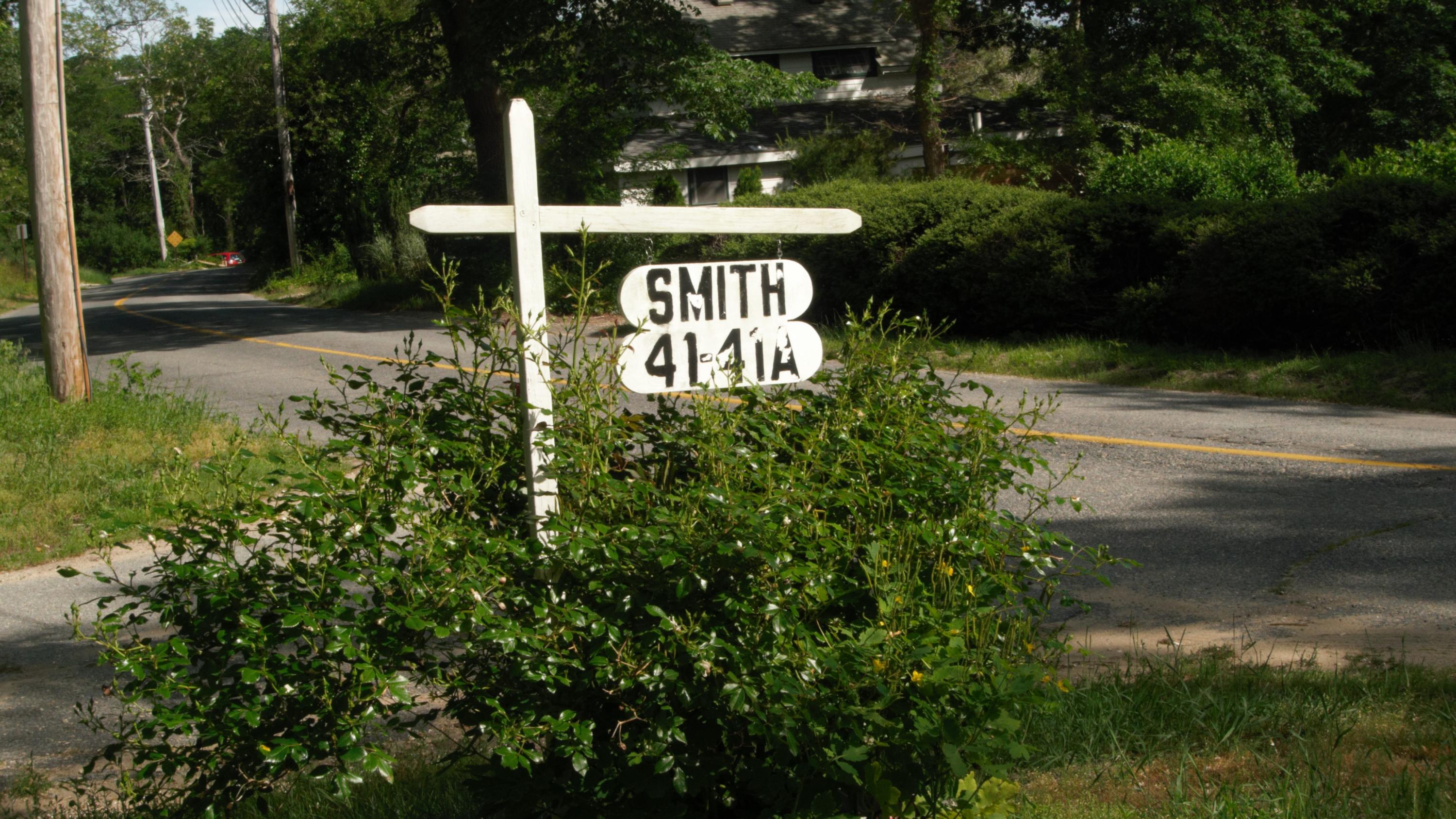 41 Castle Road Truro, MA 02666 - Photo 13 of 16 a view of outdoor space with a garden and tree