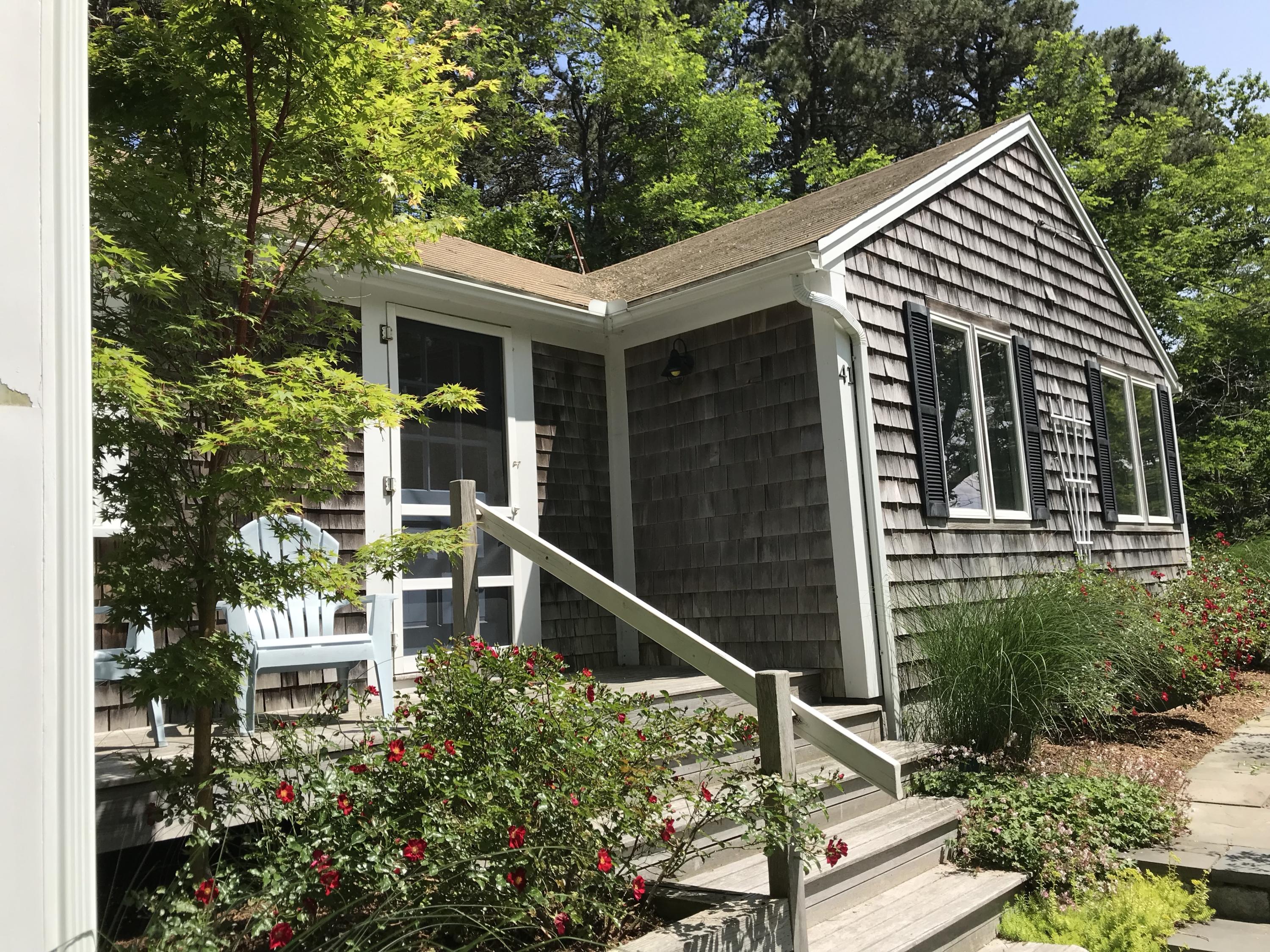 41 Castle Road Truro, MA 02666 - Photo 15 of 16 a view of house with outdoor space and sitting area
