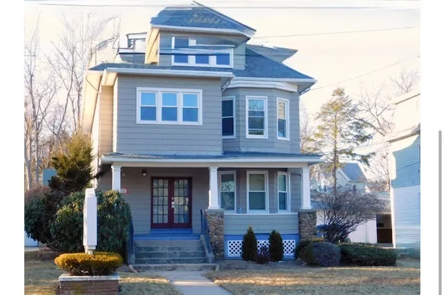 a front view of a house with a yard