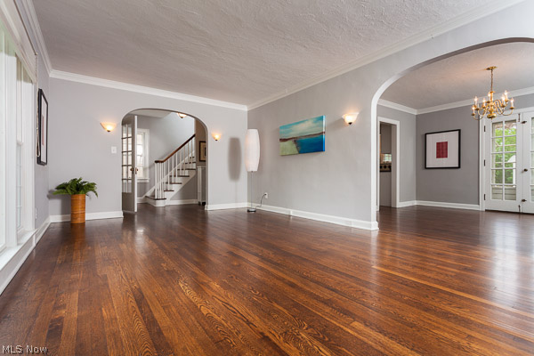 3615 Townley Road Beachwood, OH 44122 - Photo 3 of 13 Gentle arches lead to Front Entry Hall with a graceful Staircase and Foyer and also to the the larger Formal Dining Room. Newly Refinished Hardwood Floors, Neutral Paint, Crown Molding, and
French Doors exude character.
