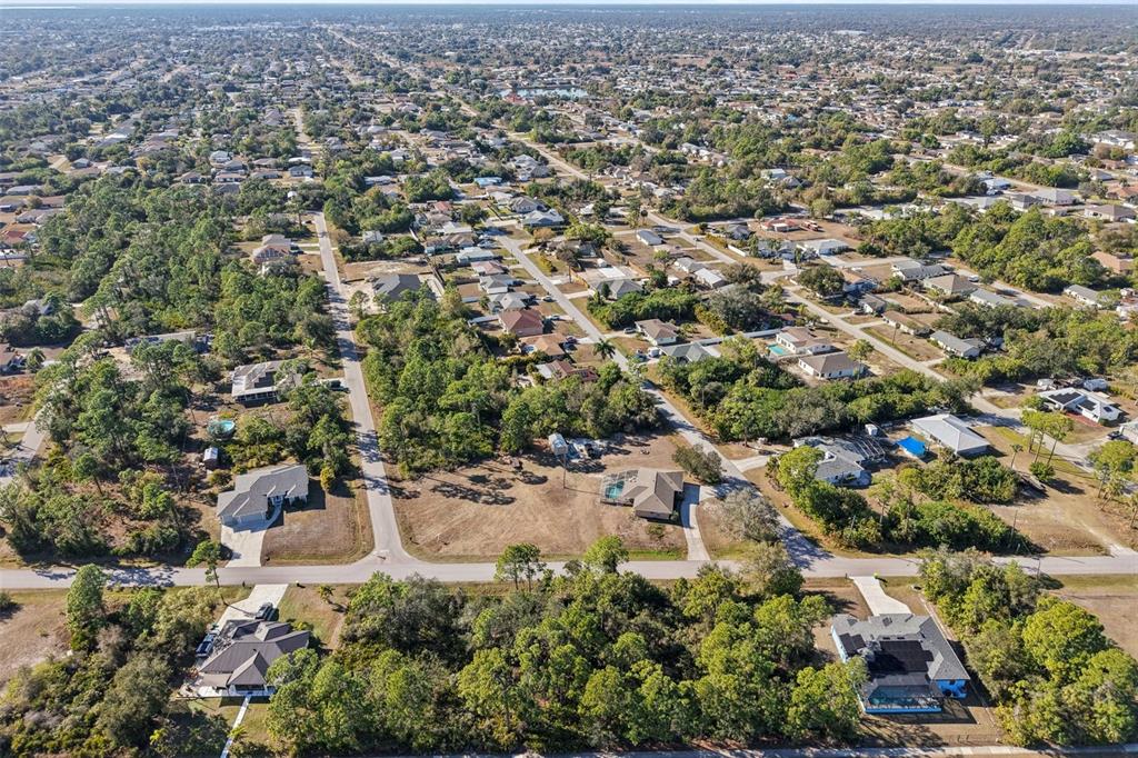 3124 Vessels Road Punta Gorda, FL 33980 - Photo 9 of 13 an aerial view of residential house with parking and trees