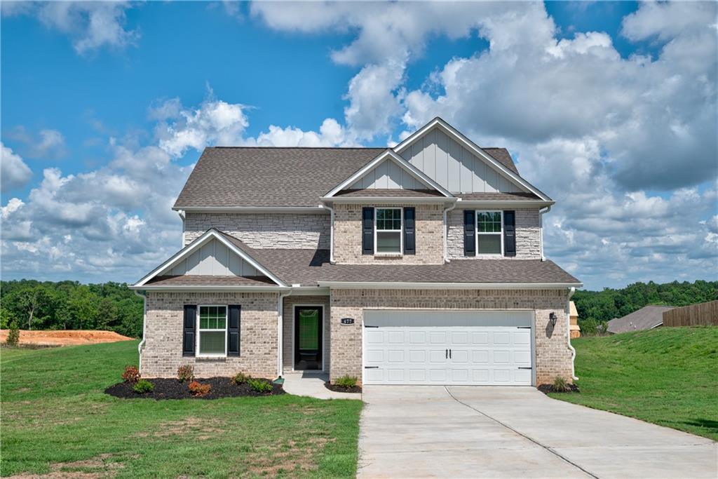 477 Samara Court Fairburn, GA 30213 - Photo 1 of 1 a front view of a house with a garden
