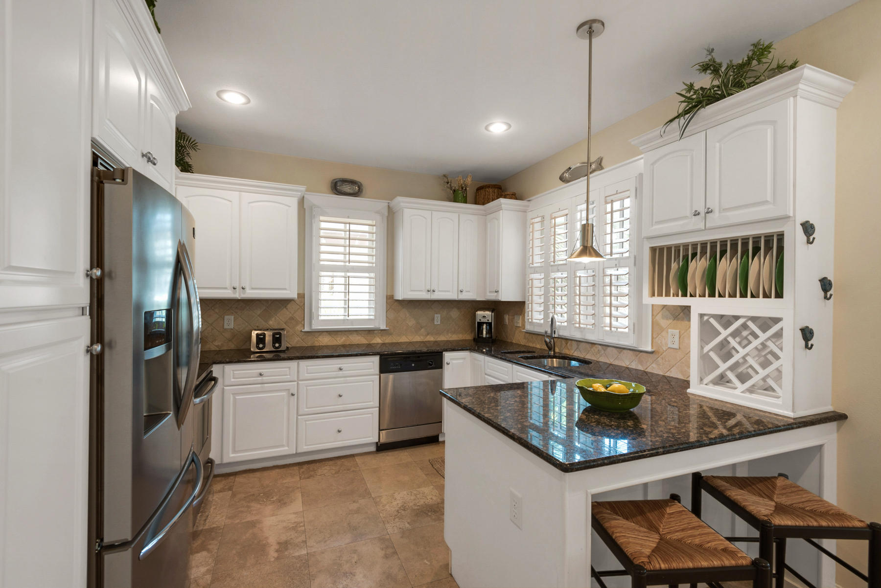 31 Sunset Beach Blvd Inlet Beach Inlet Beach, FL 32461 - Photo 11 of 28 a kitchen with stainless steel appliances granite countertop a sink a stove and a refrigerator