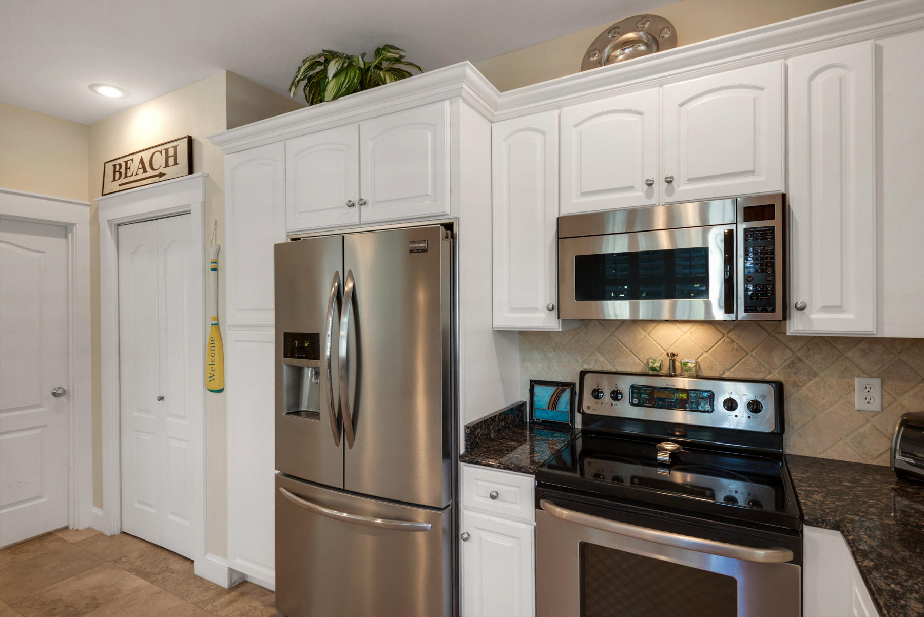 31 Sunset Beach Blvd Inlet Beach Inlet Beach, FL 32461 - Photo 13 of 28 a kitchen with stainless steel appliances a refrigerator stove and microwave