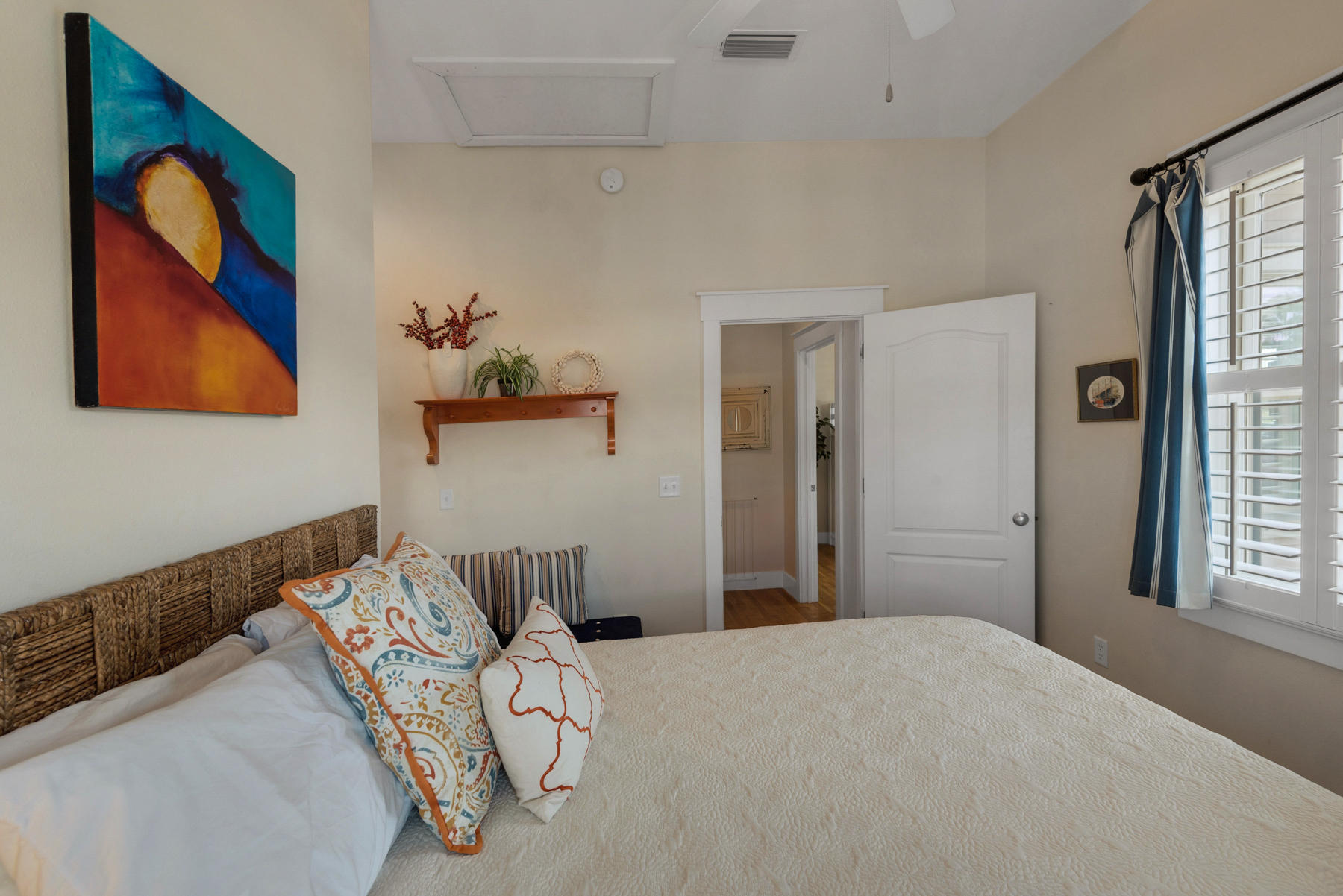 31 Sunset Beach Blvd Inlet Beach Inlet Beach, FL 32461 - Photo 16 of 28 a bedroom with a bed and a painting on the wall