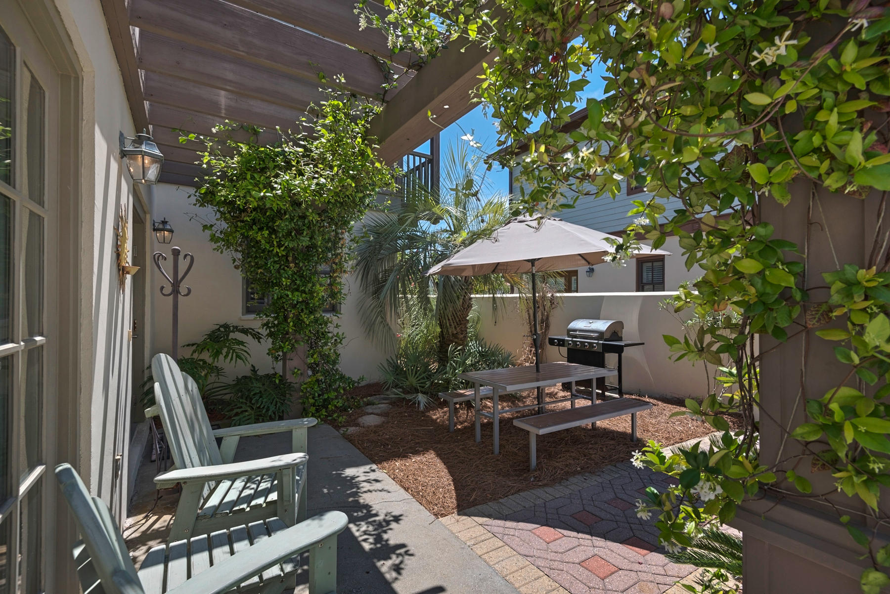 31 Sunset Beach Blvd Inlet Beach Inlet Beach, FL 32461 - Photo 3 of 28 a patio with tables and chairs