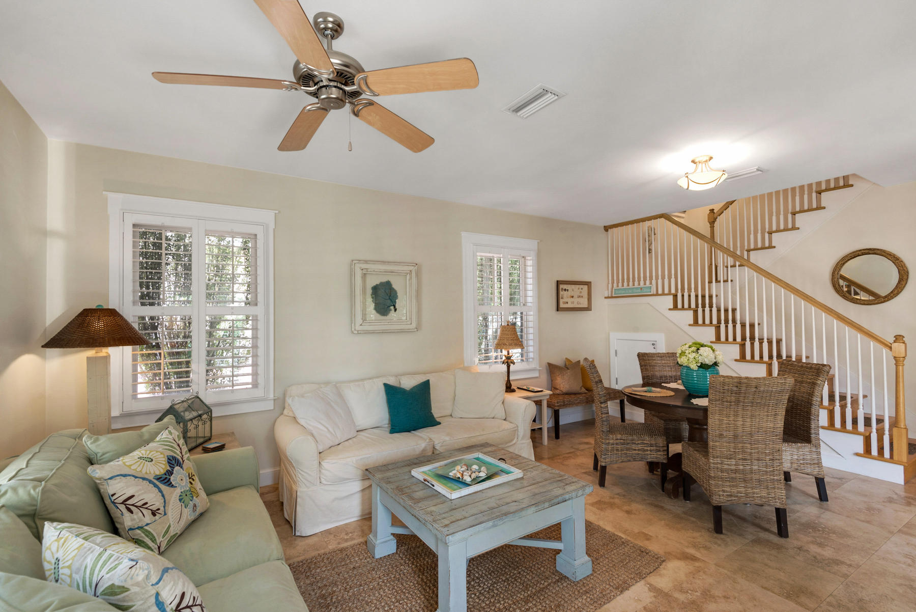 31 Sunset Beach Blvd Inlet Beach Inlet Beach, FL 32461 - Photo 6 of 28 a living room with furniture a chandelier fan and a window