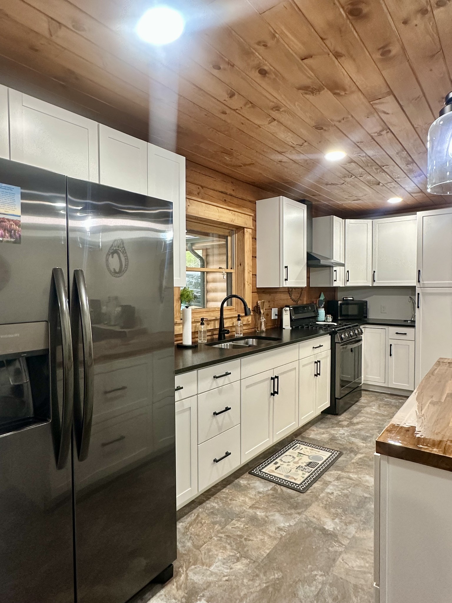 673 Arrowhead Road Moss, TN 38575 - Photo 14 of 31 a kitchen with granite countertop a refrigerator and a sink