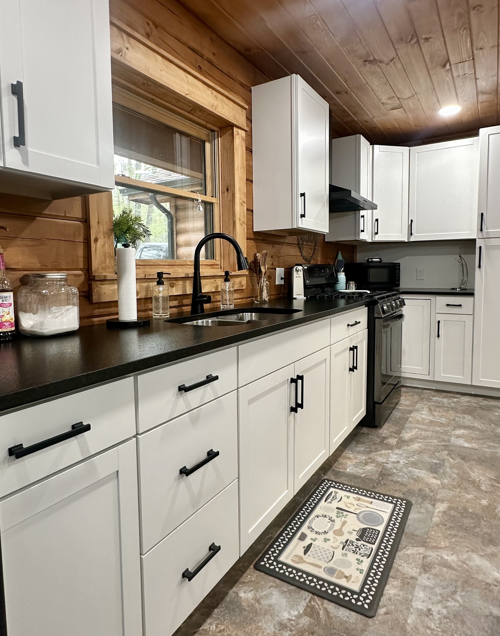 673 Arrowhead Road Moss, TN 38575 - Photo 15 of 31 a kitchen with granite countertop a sink stainless steel appliances and cabinets