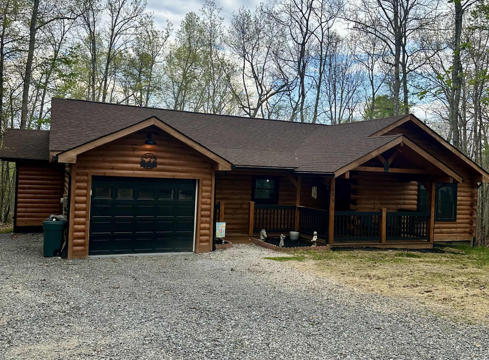 673 Arrowhead Road Moss, TN 38575 - Photo 27 of 31 a front view of a house with a yard and garage