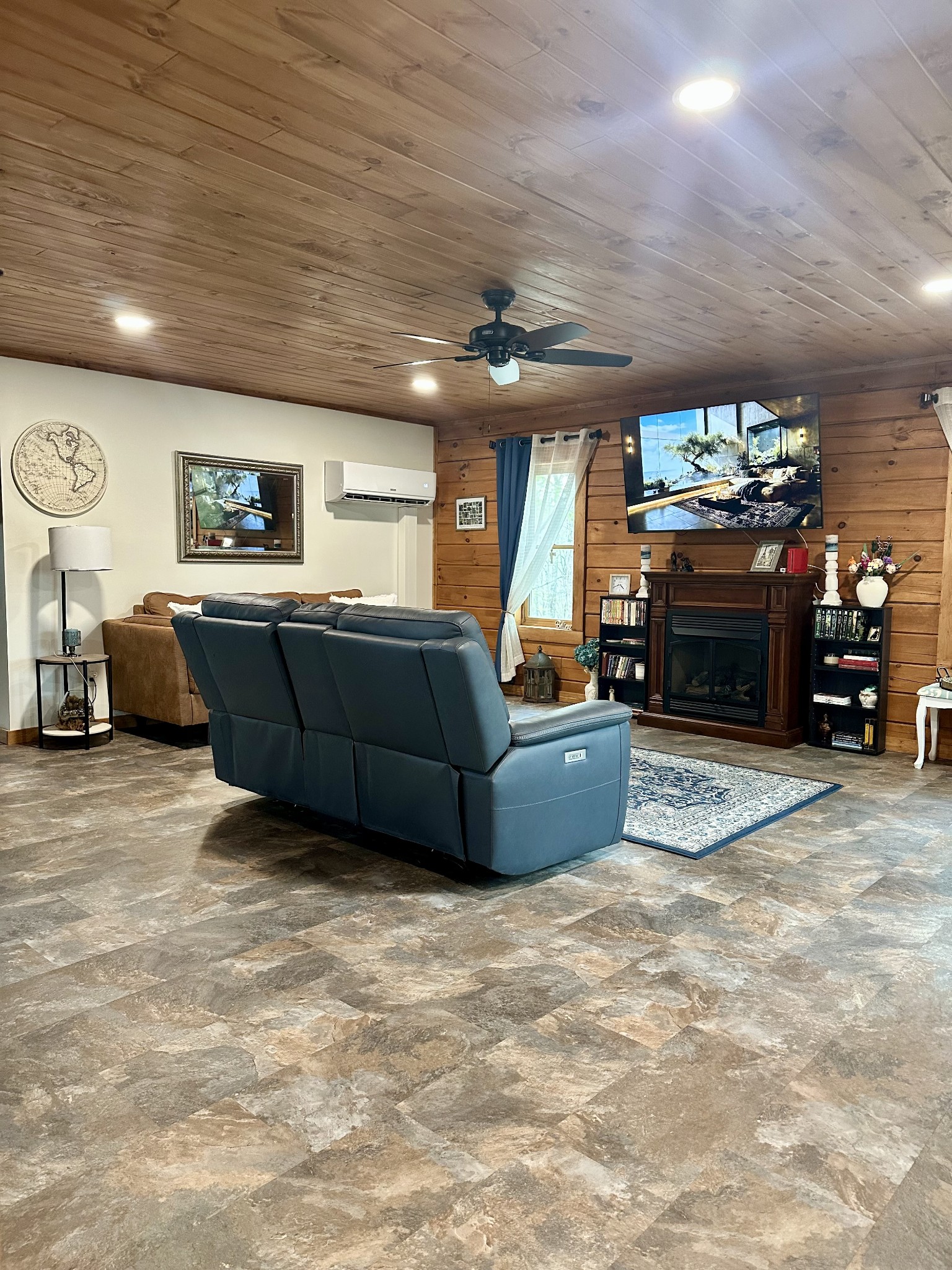 673 Arrowhead Road Moss, TN 38575 - Photo 8 of 31 a living room with furniture a fireplace and a flat screen tv
