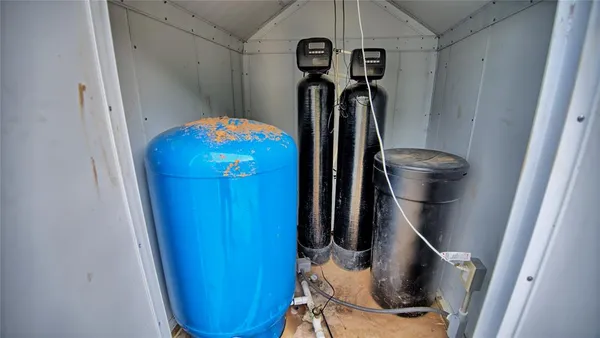 a view of storage and utility room with a sink