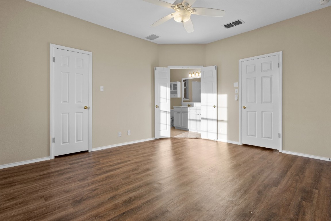 12401 Los Indios Trail, Unit 44 Austin, TX 78729 - Photo 12 of 28 a view of empty room with wooden floor