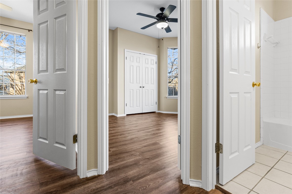12401 Los Indios Trail, Unit 44 Austin, TX 78729 - Photo 18 of 28 a view of a hallway with wooden floor and closet area