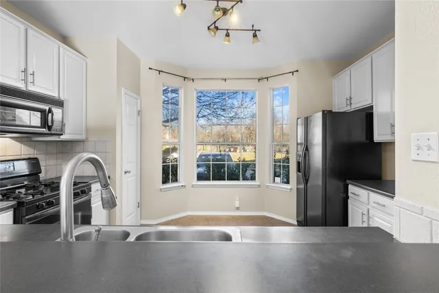 a view of a livingroom with a kitchen