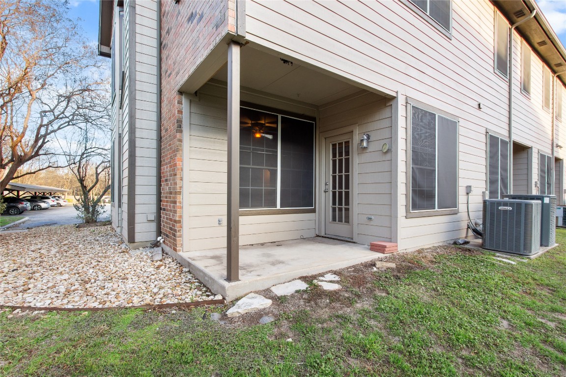 12401 Los Indios Trail, Unit 44 Austin, TX 78729 - Photo 27 of 28 a view of a house with a yard and pathway