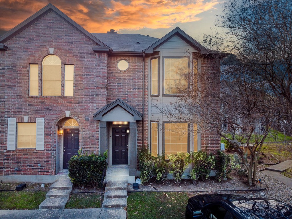 12401 Los Indios Trail, Unit 44 Austin, TX 78729 - Photo 28 of 28 a front view of a house with garden