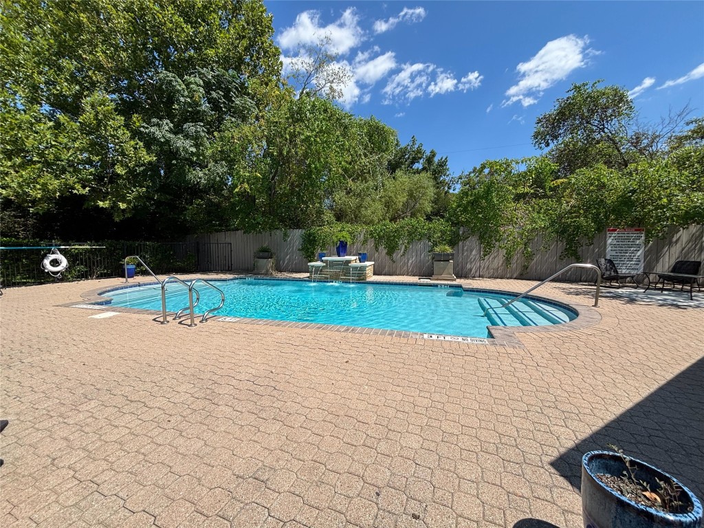 12401 Los Indios Trail, Unit 44 Austin, TX 78729 - Photo 4 of 28 a view of a park with swings