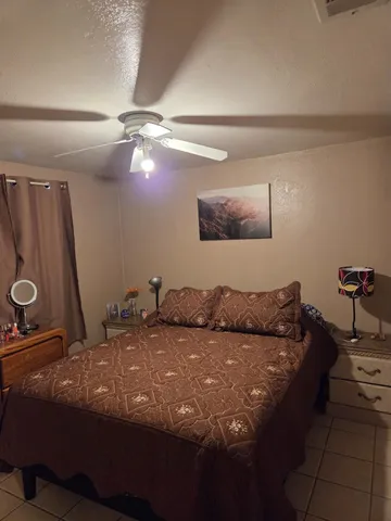 a bedroom with a bed and cabinets