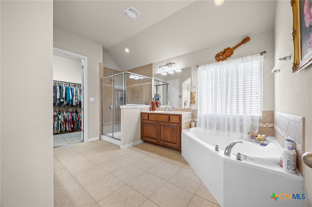 1205 Winding Way Drive Georgetown, TX 78628 - Photo 30 of 39 Primary bathroom with tile throughout and two single vanities
