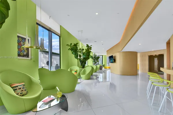 a swimming pool with outdoor seating and yard