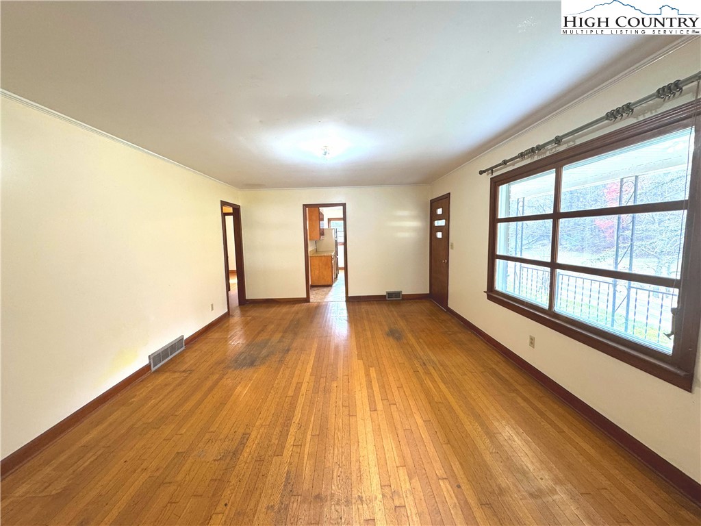 2510 Rich Hill Road Creston, NC 28615 - Photo 5 of 38 wooden floor in an empty room with a window
