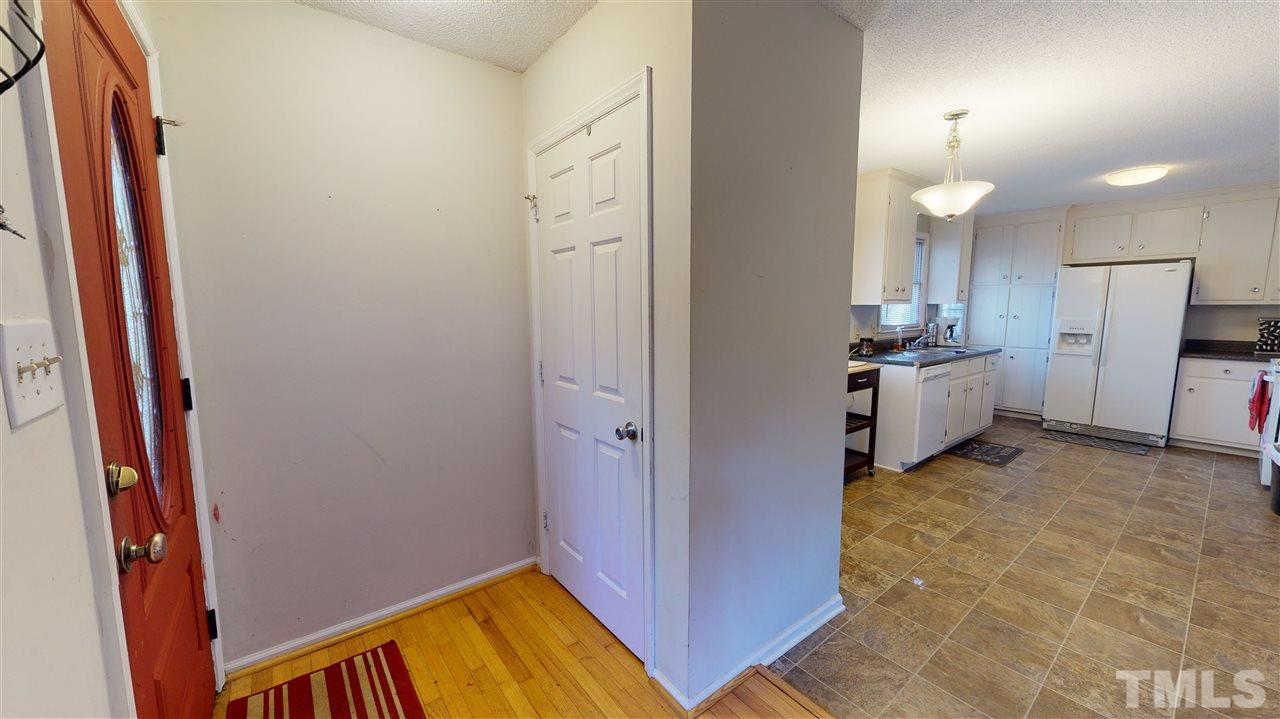 1503 Cole Mill Road Durham, NC 27705 - Photo 2 of 29 a view of a kitchen from the hallway