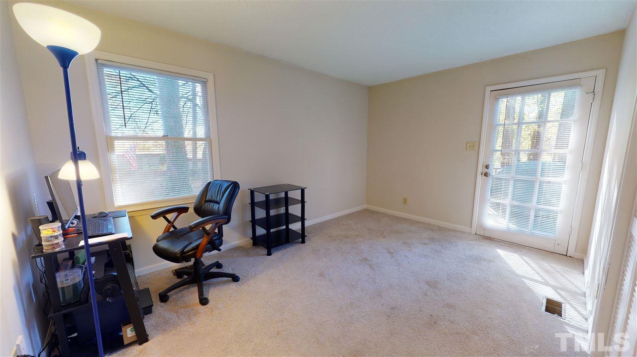 1503 Cole Mill Road Durham, NC 27705 - Photo 15 of 29 a view of a workspace with furniture and a window