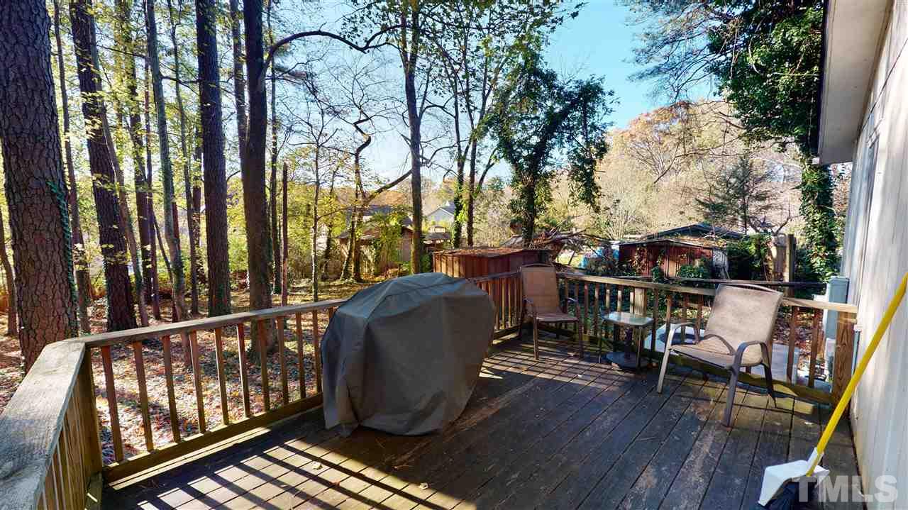 1503 Cole Mill Road Durham, NC 27705 - Photo 23 of 29 a view of balcony with furniture and wooden fence