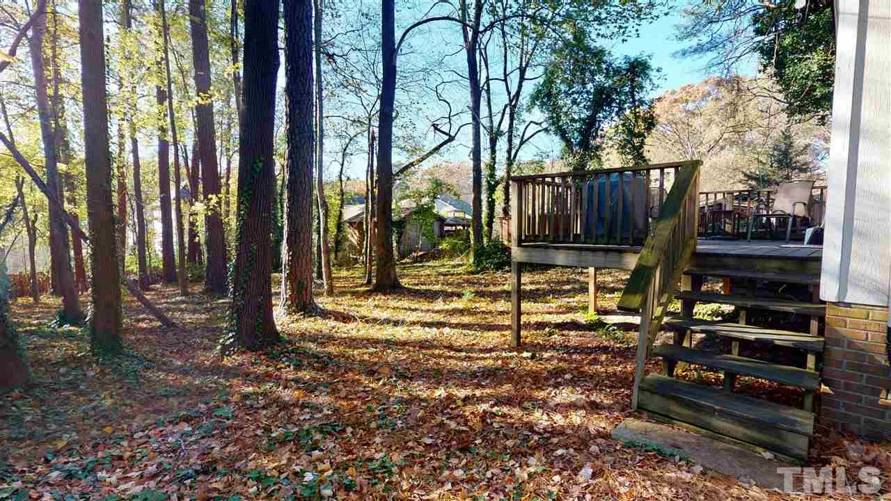 1503 Cole Mill Road Durham, NC 27705 - Photo 24 of 29 a view of a house with backyard and trees